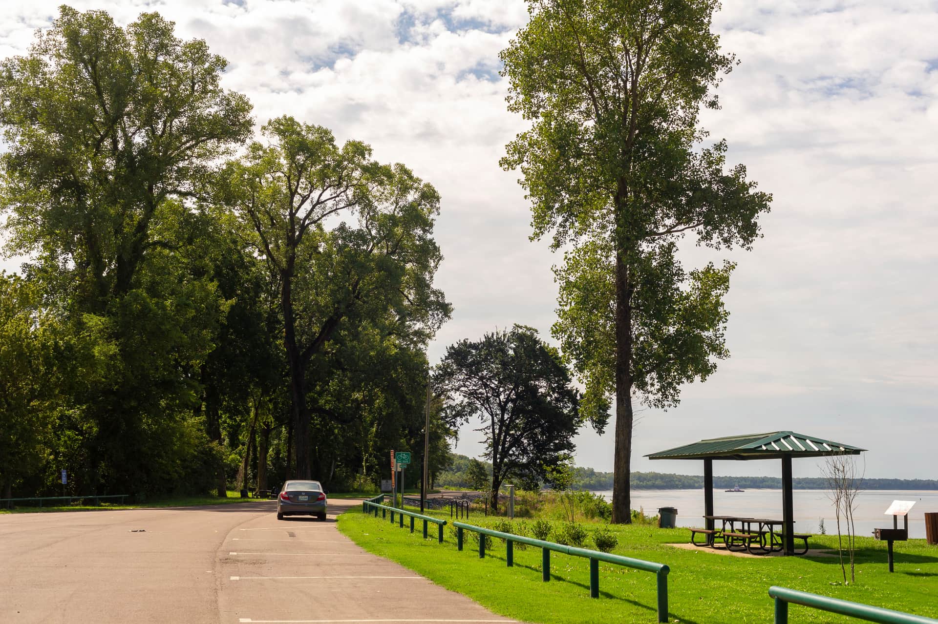Paved trail and picnic pavilion overlooking the Mississippi River at Hernando DeSoto River Park in Walls